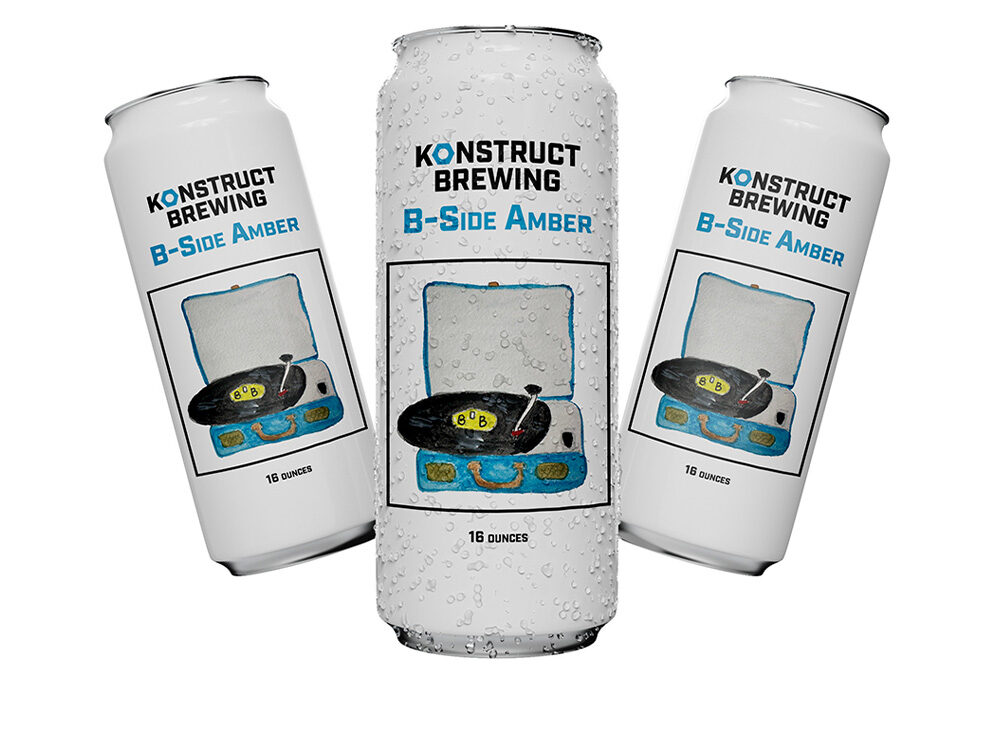 Three cans of Konstruct Brewing's B-Side Amber