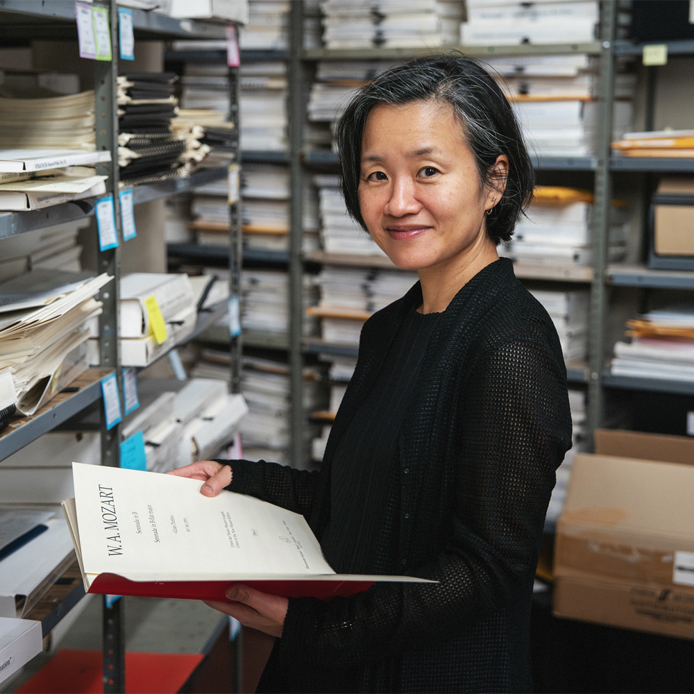 Assistant Librarian Hitomi Sipher reading a score in the Library