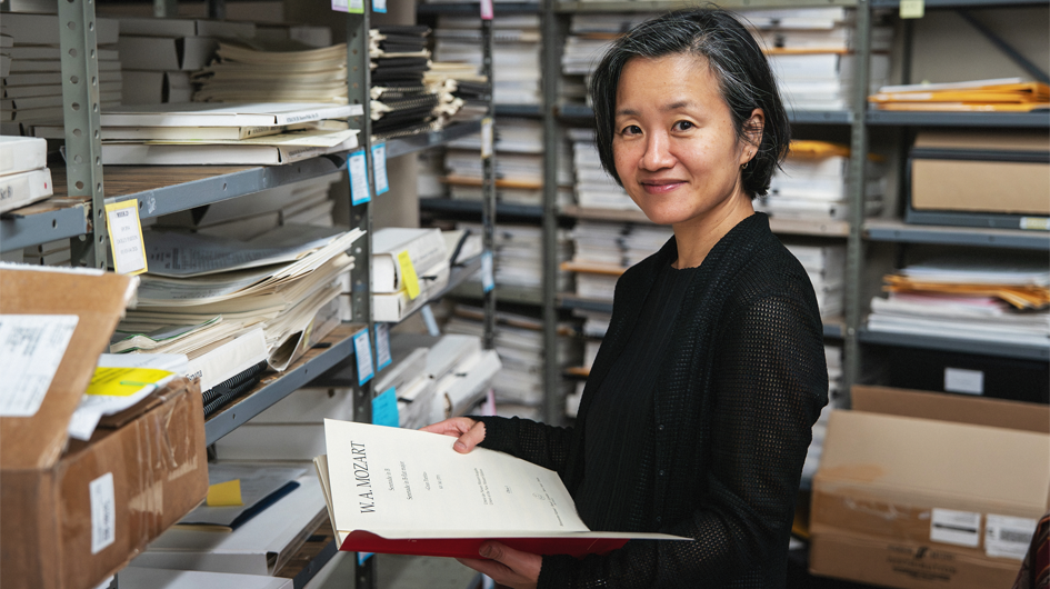Assistant Librarian Hitomi Sipher studies a score in the Colorado Symphony Library